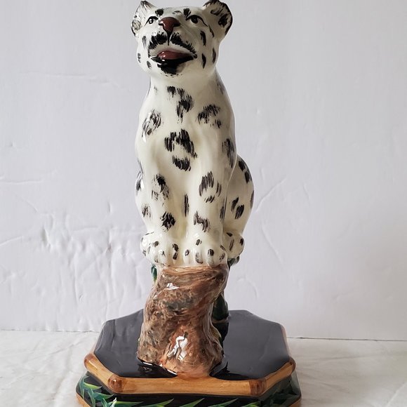 Ceramic Cheetah Sitting on a Branch